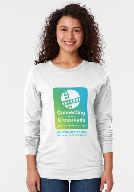 Person wearing a white ARSL 2022 conference logo long sleeve shirt.